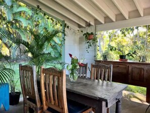 Enjoy outdoor living on the lower lanai-- garden view, barbecue, dining area