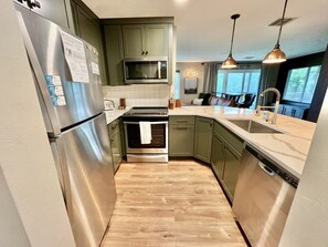 Lux kitchen with granite countertops & stainless appliances