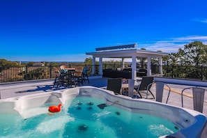 The Porches features several outdoor spaces, including this fabulous roof deck with hot tub & ocean views.