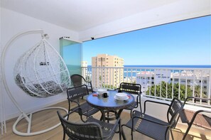 Beautiful terrace with outdoor dining area and stunning sea views