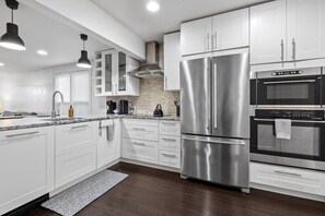 Modern and functional kitchen with peninsula seating and stainless steel appliances