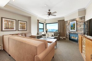 Living room features a sleeper sofa, TV, and fireplace (Ridge Tahoe).