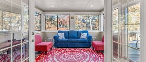 Enjoy your morning coffee in our beautiful sunroom living space overlooking the patio & backyard. This room features a full size pullout couch and a dedicated workspace!