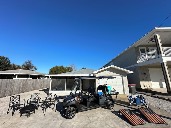 Play some  corn hole and relax around the fire pit. Just don’t use the corn hole wood for the fire 😜😉! Use the wagon and coolers when you take the 6 
person cart to one of several beach accesses just down the street. Go East or west from the house on sunset and turn toward the sound of the waves!