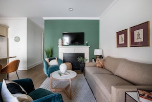 Spacious living room with TV