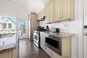 Fully stocked kitchen with bar seating