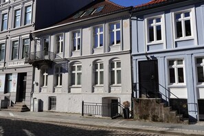 A glimpse into a historic neighborhood, with well-maintained buildings.
