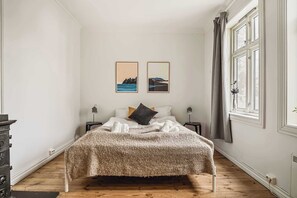 Peaceful bedroom featuring soft lighting and cozy bedding.