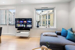 Say hello to a big and comfy sofa. Space for the whole family to enjoy the multiple streaming choices on the TV.