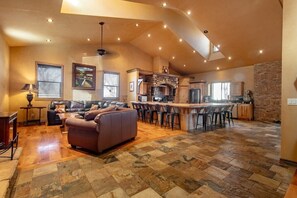 Gather around this expansive kitchen island, perfect for family meals and socializing. You’ll love the ample seating, natural light, and open layout that seamlessly connects the kitchen to the living area, fostering togetherness.
