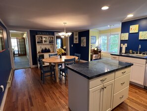 Dandelion kitchen looking into the sunroom, dining room and living room.