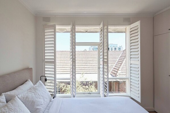 Bask in the light-filled bedroom, offering a tranquil sanctuary to rest your head each night.