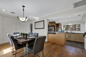 The dining and kitchen spaces seamlessly merge.