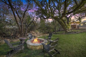 Forge new connections as you gather around the shared fire pit and relish a delightful evening in the Hill Country! (The fire pit is a communal space for all four units on the property.)