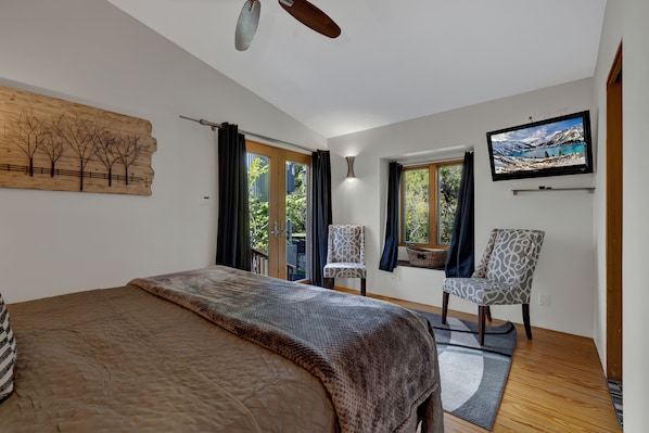 Relax in the king bed with the flat screen TV.