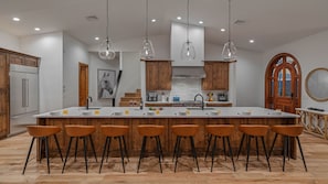 Large gourmet kitchen with an 8-seat breakfast bar