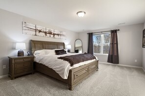 Master bedroom with king bed and attached master bath