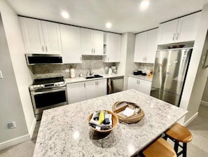 Fully renovated kitchen with breakfast bar