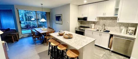 Fully renovated kitchen with breakfast bar