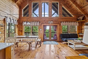 Dining and living room seating with deck entry at Bear Sunrise