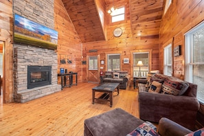 Sofa and chair in the living room at Moonshine Memories, a 2 bedroom cabin rental located in Gatlinburg