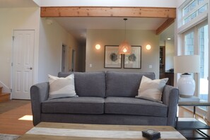 Comfortable new sofa and furnishings, with separate dining room adjacent.