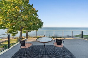 Upstairs balcony with seating to enjoy sunsets!  Access to balcony from Bedroom 1.