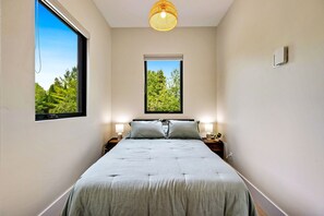 Off the main entrance you'll find a cozy den converted for additional sleeping arrangements or relaxation. 