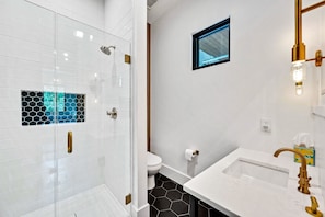 First floor bathroom offers an incredible walk in shower and newly renovated stylish design.