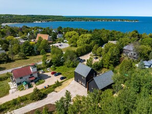 Welcome to the Nordica House and Loft, a modern and design-driven retreat located in the heart of Egg Harbor. This spacious property features a den, 5 bedrooms, 4 bathrooms, and offers a perfect balance of style and guest comfort.