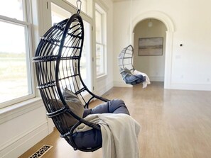 Peaceful, comfortable & FUN! These are some of the ways we want to describe the Edna Estate & these hanging chairs check all the boxes! You can hang out w/ the group & watch a movie, snuggle up to read a book, or flip around & enjoy the gorgeous view