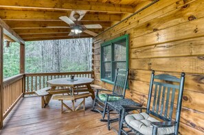 Relax in a rocker at this very private luxury cabin rental in North Georgia