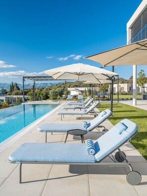 Spacious private pool surrounded by sun loungers on the patio of the luxury Croatian villa Bracchia 2 Magic Retreat on the island of Brac