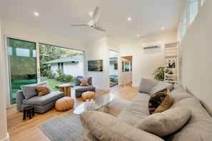 Relax in this breezy, island-inspired lounge where natural textures and soothing tones set the scene for tranquil days.