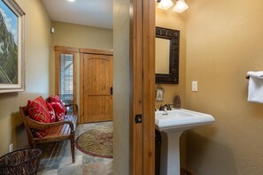 A conveniently located guest bathroom right inside the entryway