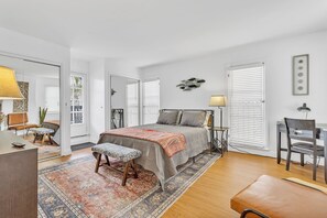 A spacious bright and airy upstairs room with balcony