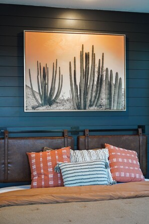 Villa 1 -  sleek black shiplap and a cozy floating headboard with firm mattress.