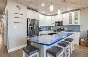 This island countertop is imported Brazilian stone quartzite. Simply beautiful!