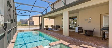 Sun-soaked leisure awaits in our private pool and spa, encased in a screened lanai for your comfort.