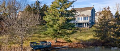 Waterfront property surrounded by trees.