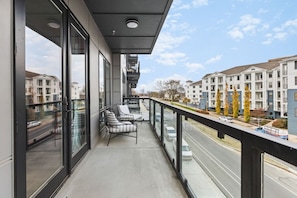 Large wrap-around private patio with seating, perfect for enjoying your morning coffee!