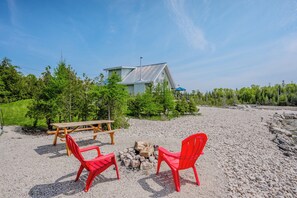 The lot is large and private, with a firepit for year-round bonfires, allowing you to relax without worrying about neighbors.
