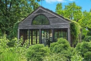 Exterior: A verdant escape awaits. Immerse yourself in nature's embrace.