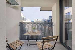 The balcony provides a perfect spot for enjoying the fresh air. 