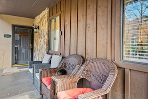 Mountain Charm's relaxing patio with armchairs