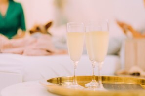 Cheers with a drink in the room!