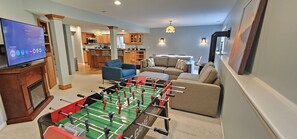 Foosball and living room with Smart TV