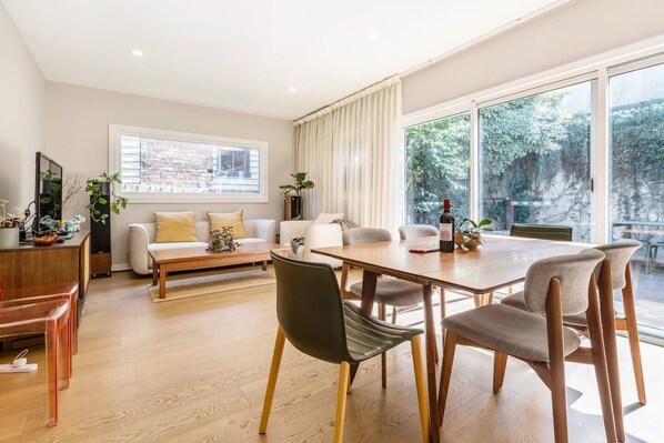 The open plan living and dining area is tastefully decorated to create a comfortable space to call home.