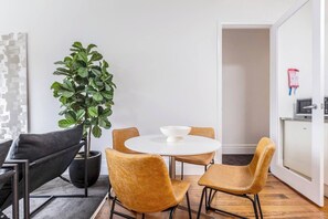 In the open-plan kitchen and dining area, you’ll find a four-seater table where you can share meals together as a group.
