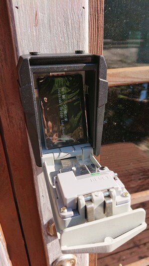 Take out the card key from the key box and touch the keypad to unlock.
